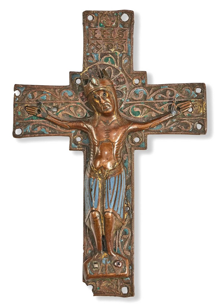 A Limoges gilt copper and champlevé enamel relief cast figural cross of the Crucified Christ