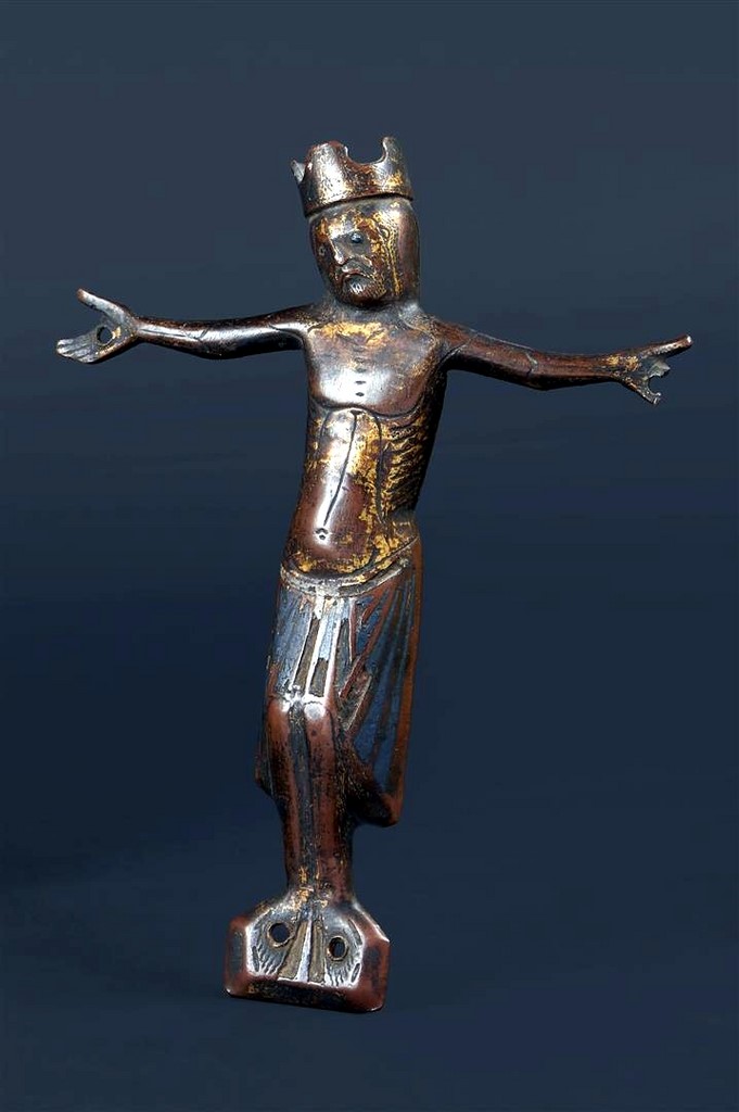 A Romanesque champlevé enamelled and gilt copper cross with a champlevé enamelled and gilt copper figure of a Christ Limoges France